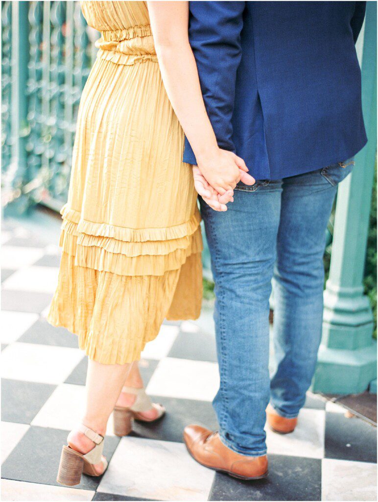 Destination engagement pictures in Charleston with yellow dress by film photographer Catherine Ann Photography
