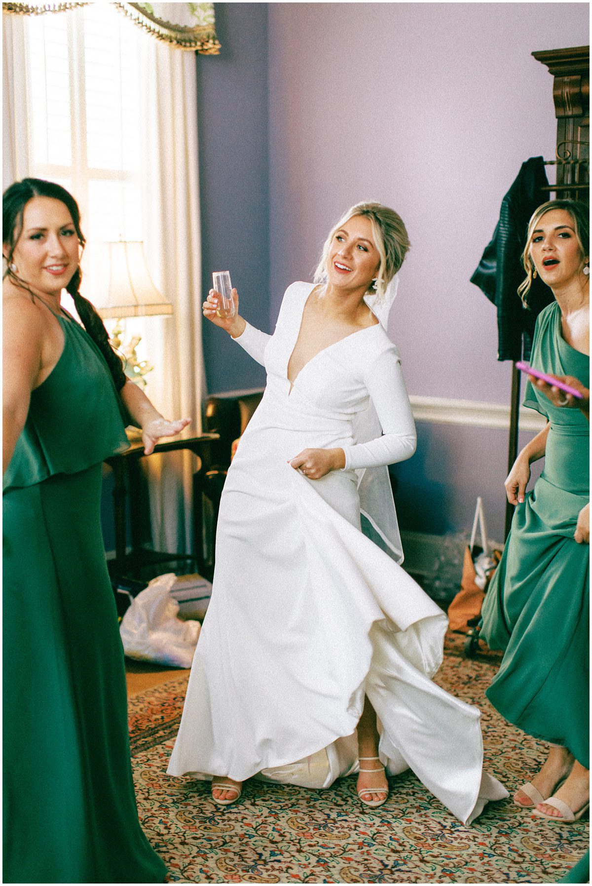 bride and bridesmaids having a dance party before the ceremony
