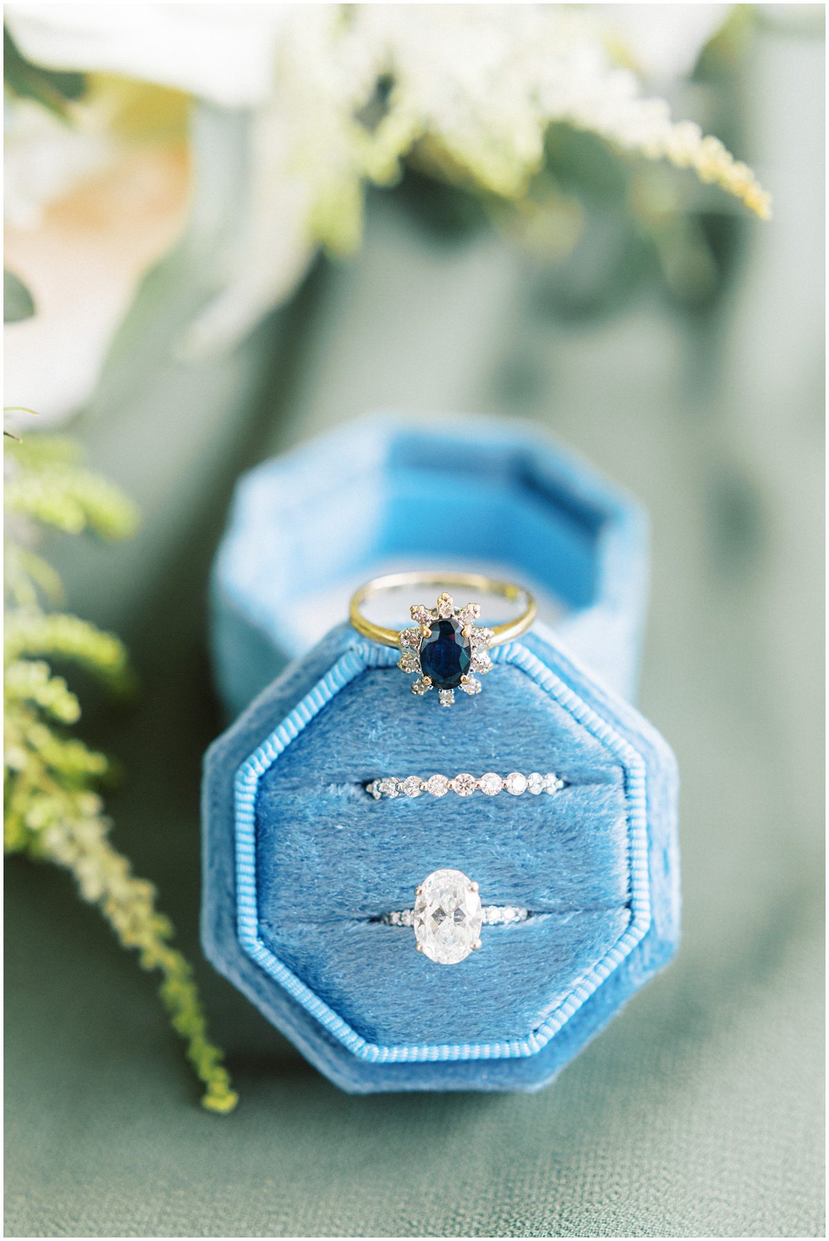 brides wedding rings in a blue mrs box