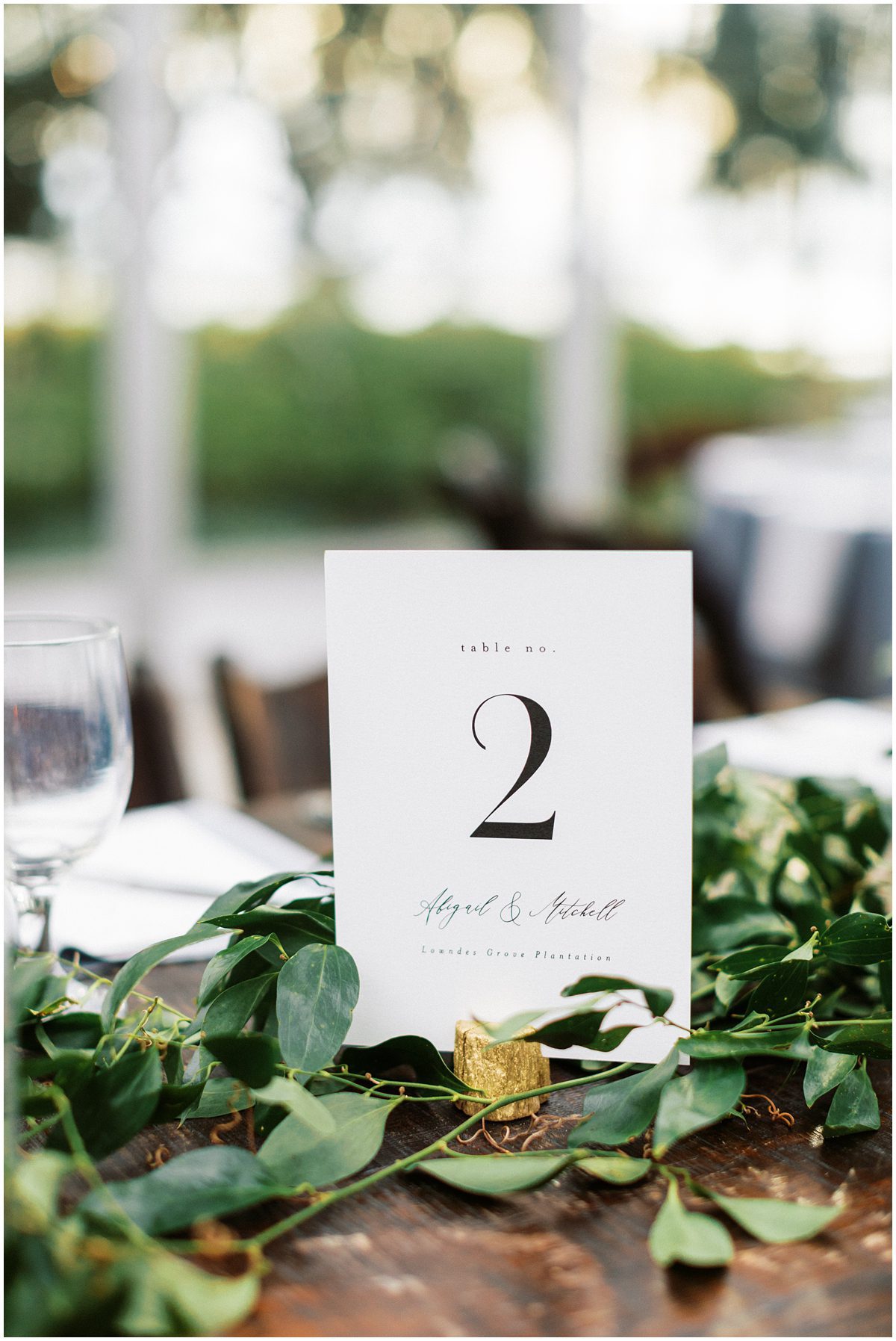 simple green and white wedding reception table number
