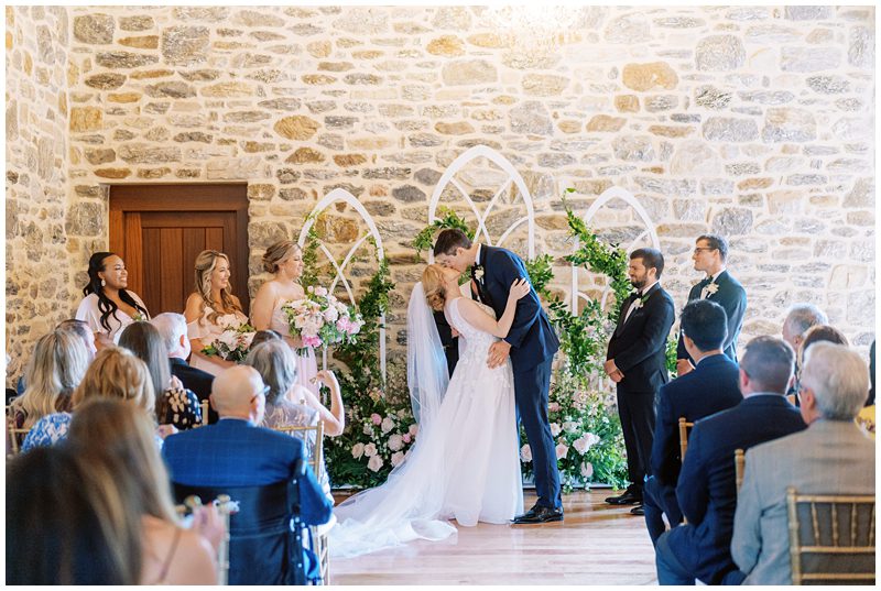 bride and grooms first kiss at their wedding at Bluestone Estate