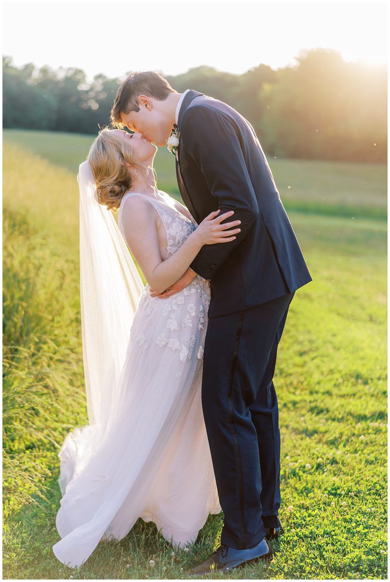 golden hour wedding photos of the bride and groom kissing in Lancaster PA 