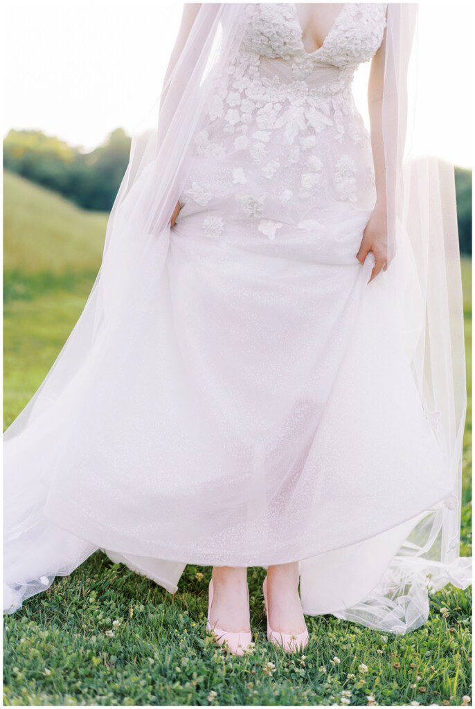 Kleinfeld bride shows off her stunning pink velvet shoes and floral wedding dress