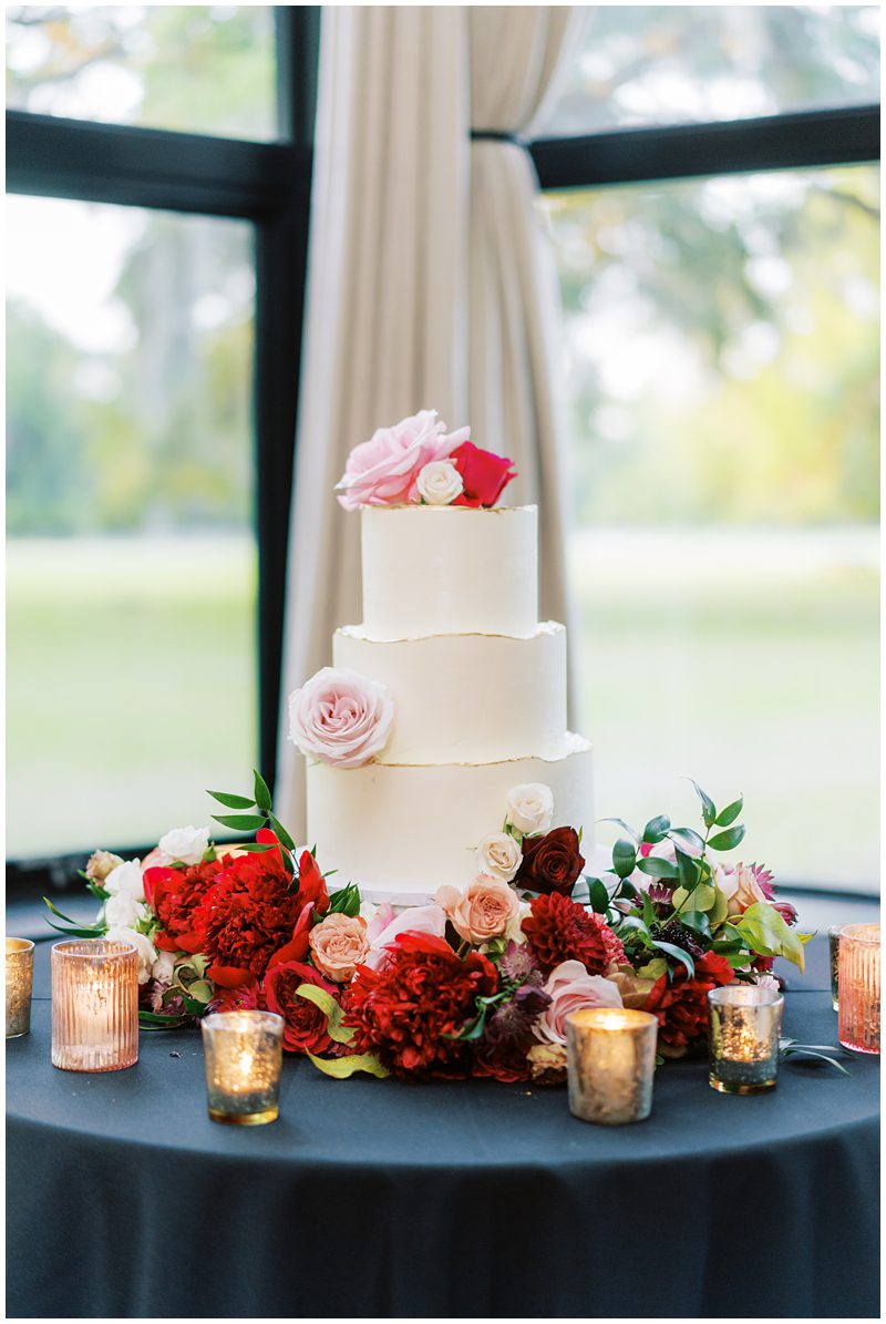 three tiered white wedding cake with pink flowers from ABCD Cakes in Charleston SC