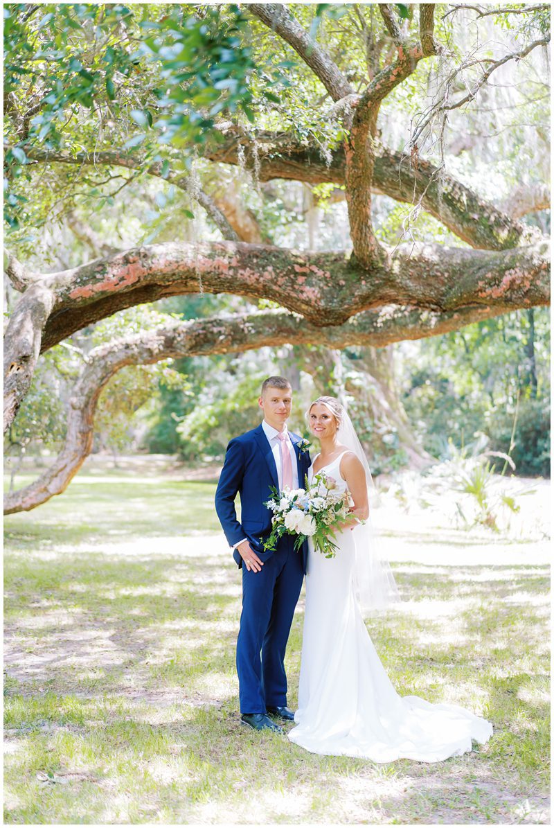 Bride and groom photo under an oak tree in Charleston