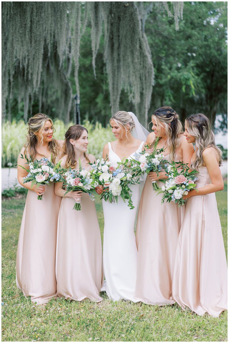 bridesmaids wearing long champagne colored dresses 