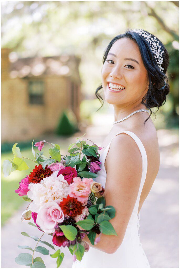 Bridal portraits at Middleton Place with a pink and burgundy wedding bouquet from Wisteria Design