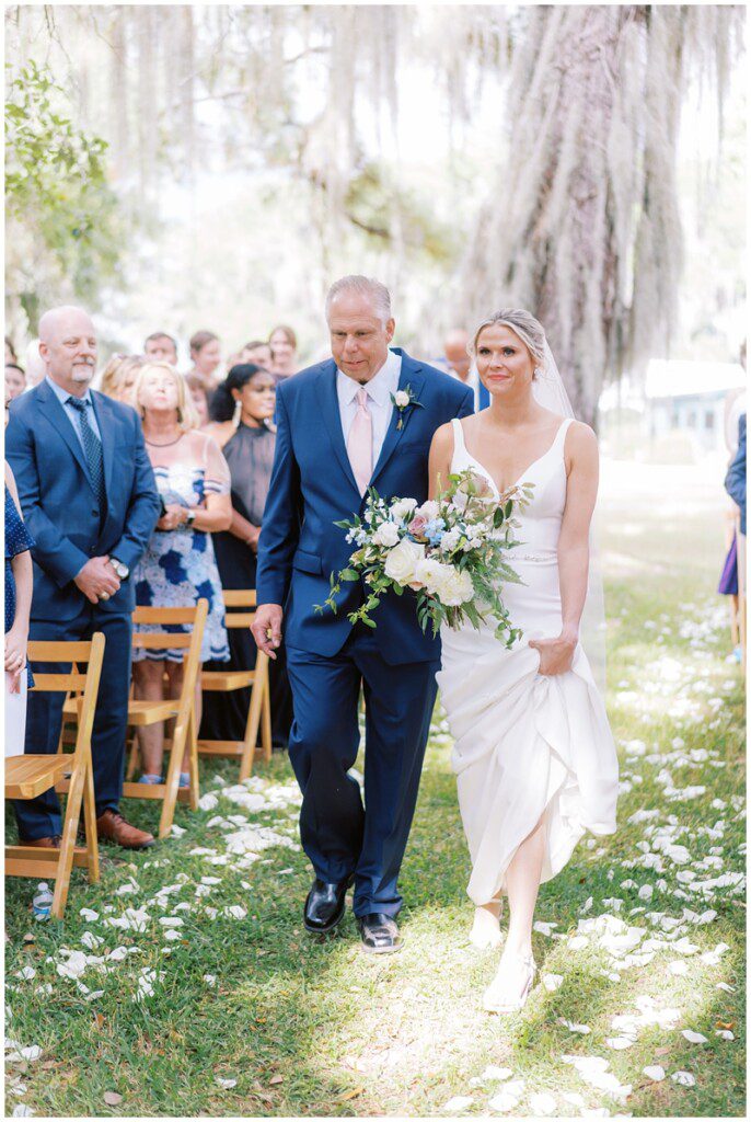 bride and her father walking down the aisle at Magnolia in Charleston