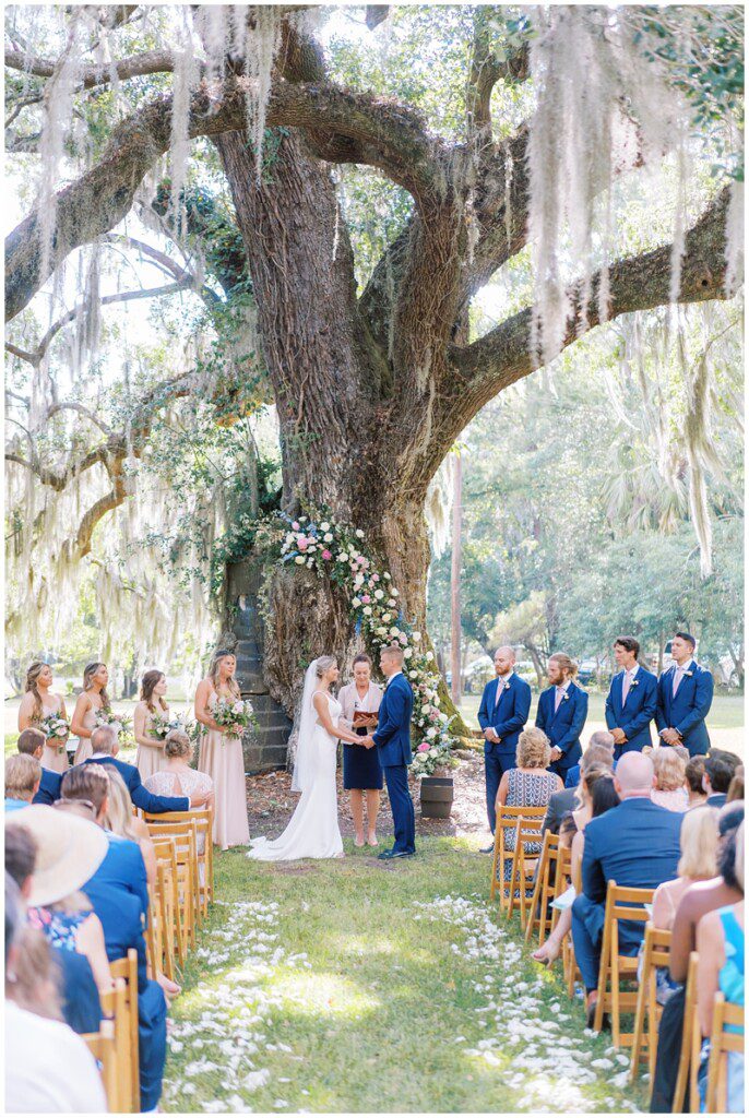 wedding ceremony under an oak tree at Magnolia in Charleston