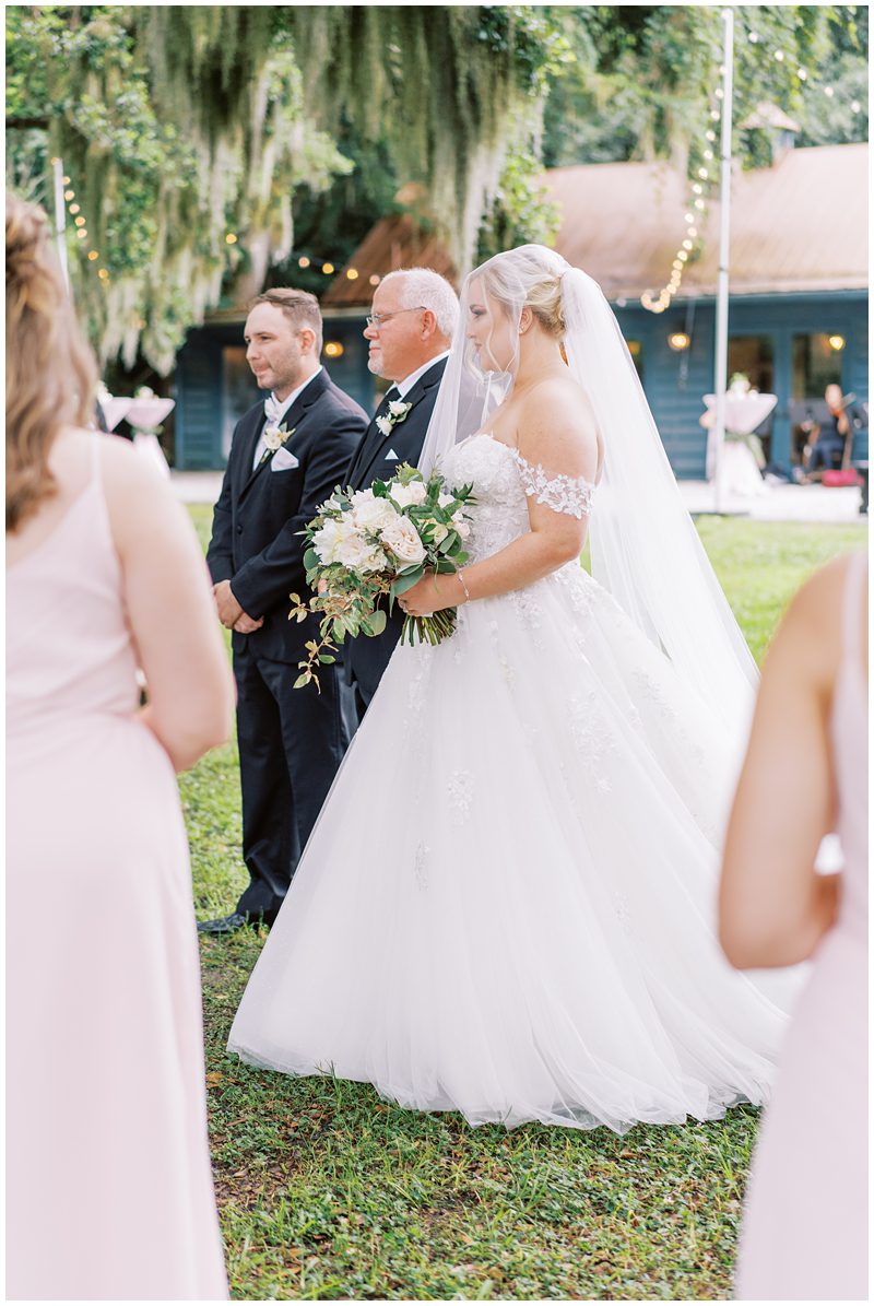 bride and her father walking down the aisle at Magnolia Gardens Carriage House