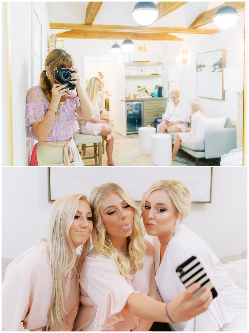 candid wedding photo of bride and bridesmaids taking a selfie