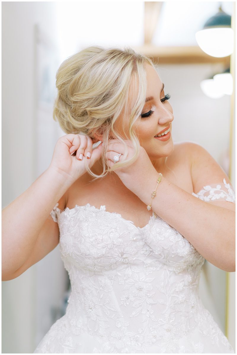 bride putting in her earrings