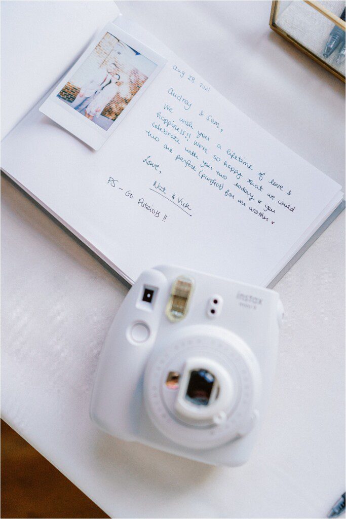 wedding guestbook with polaroid camera