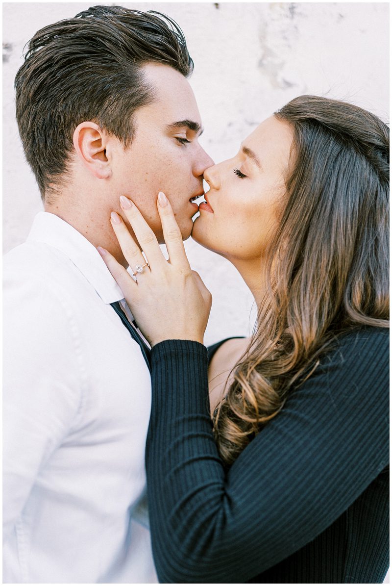 romantic Charleston engagement photo of the couple kissing