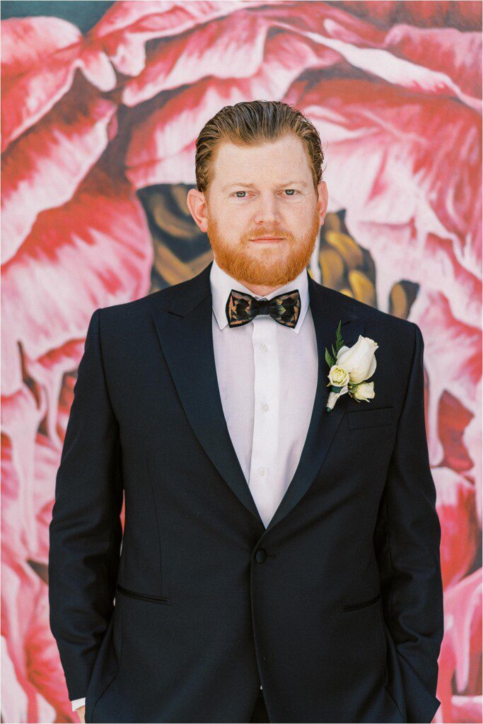 Handsome groom wearing a brackish bowtie