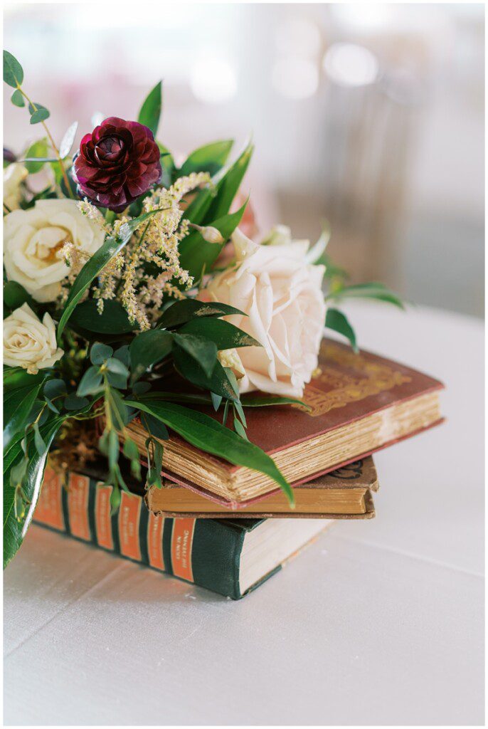 vintage books as wedding reception decor idea
