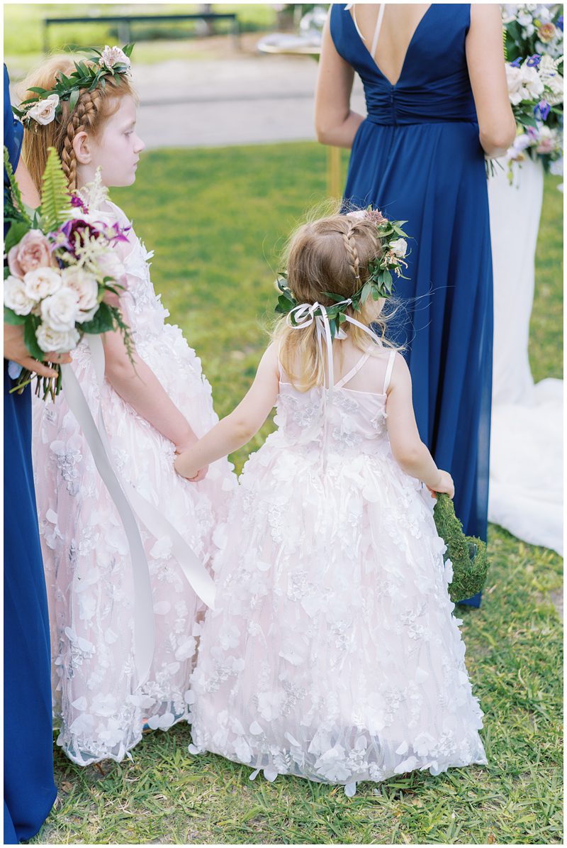 cute photo of flower girls holding hands at Lowndes Grove