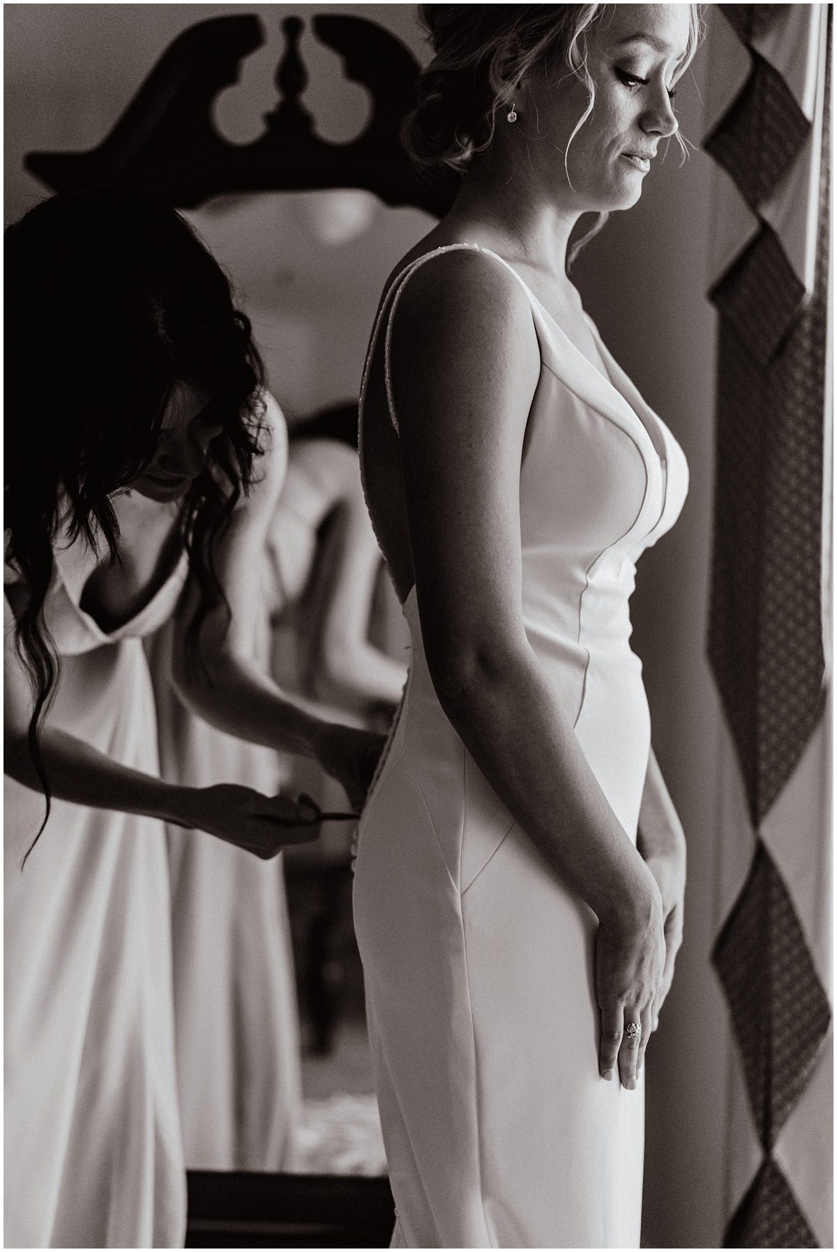 Bride getting dressed at the Island House in Charleston SC