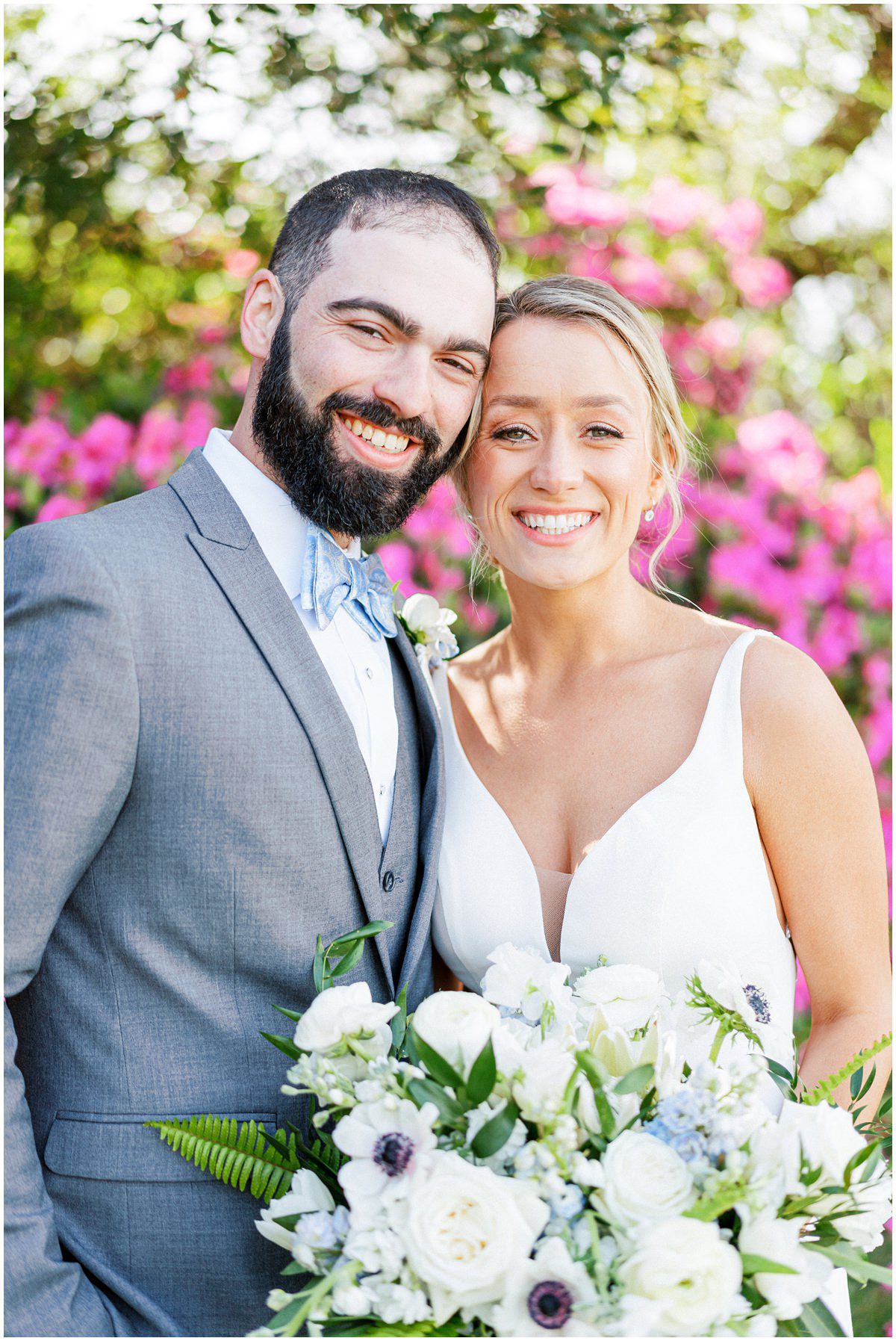 Bride and groom portrait with pink azaleas blooming at the Island House