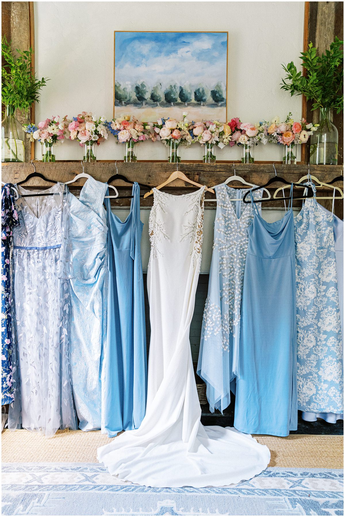 brides couture dress and mix matched blue bridesmaids dresses at Wavering Place