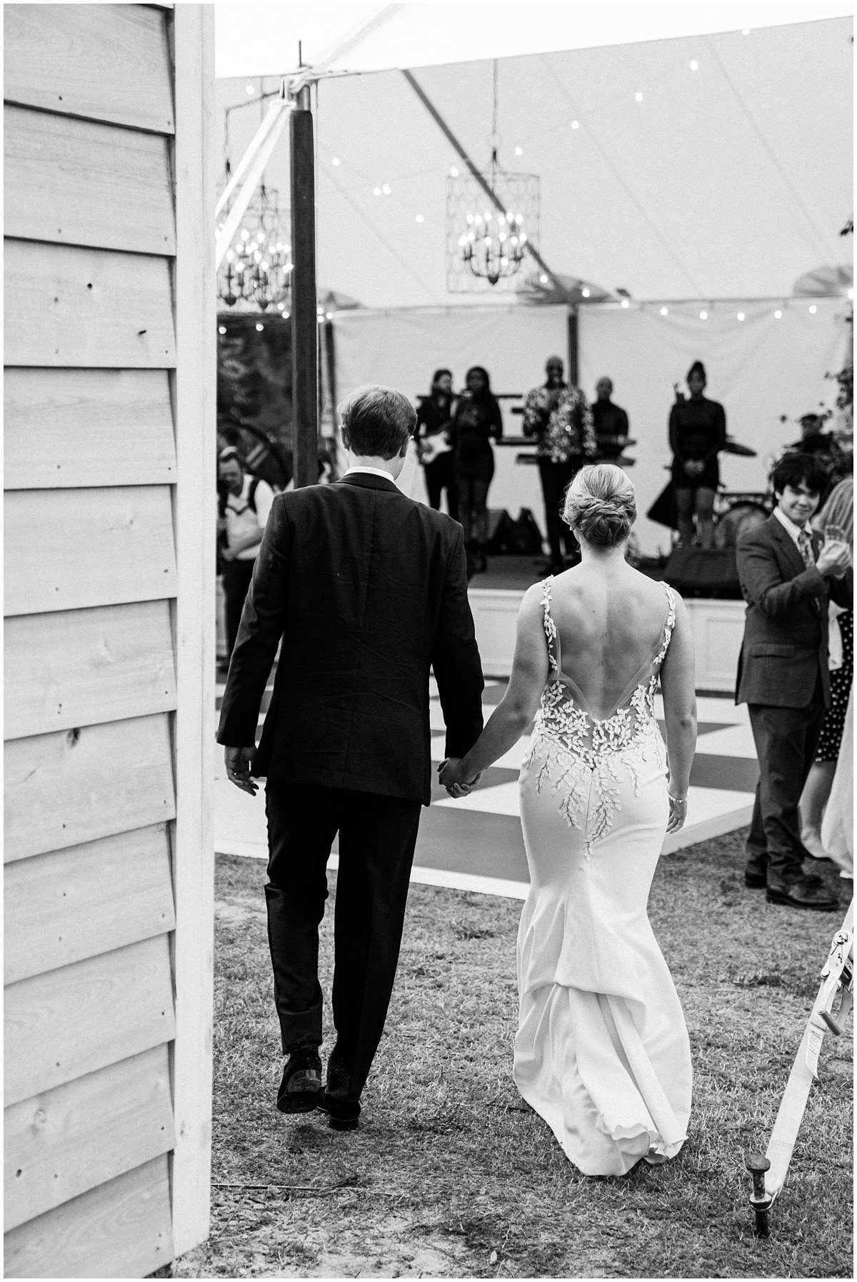 bride and groom entering their tented wedding reception at Wavering Place in Columbia SC