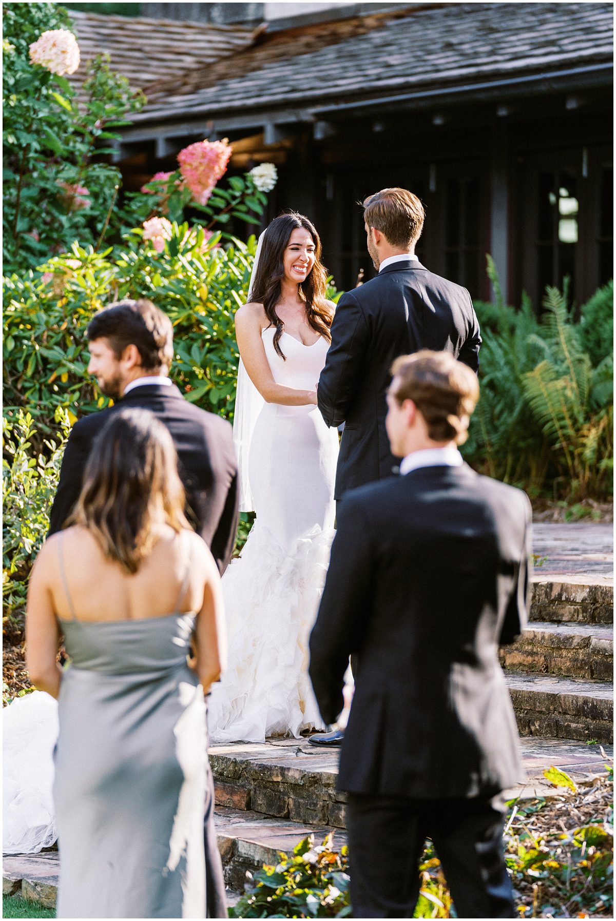 Bride laughing during the vows at Mountaintop Golf and Lake Club wedding ceremony