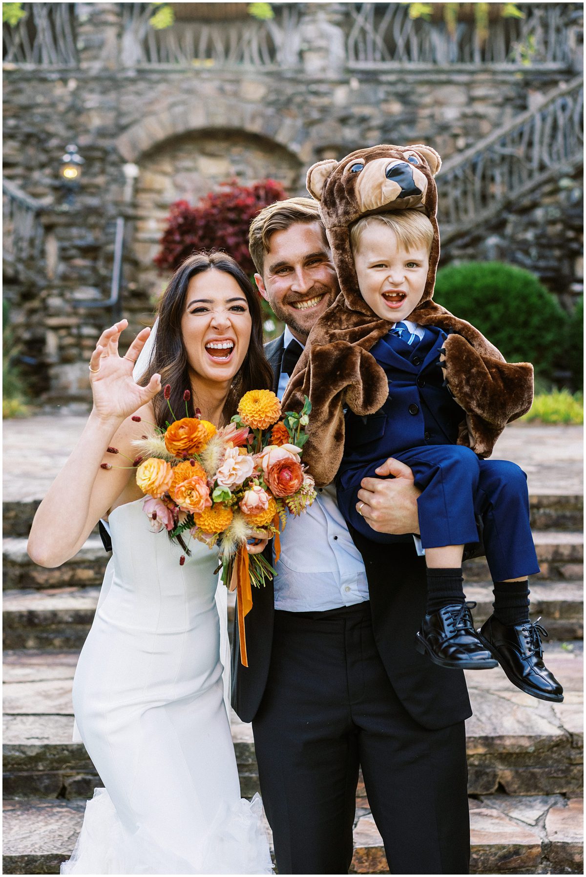 The ring bearer steals the show in a bear costume, fittingly playing the role of ring BEARer at this Highlands NC wedding