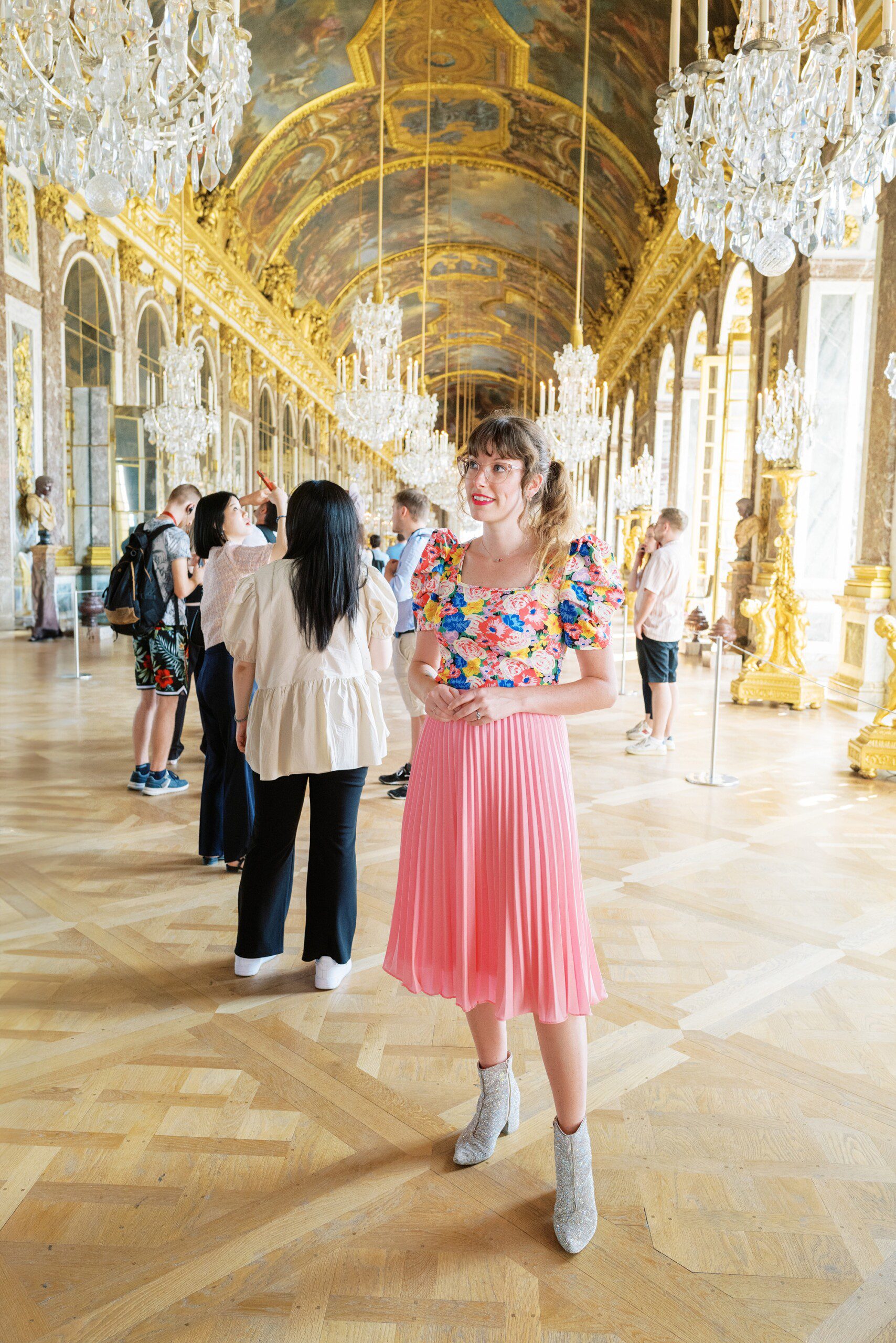 Paris France wedding photographer standing in the hall of mirrors at Versailles