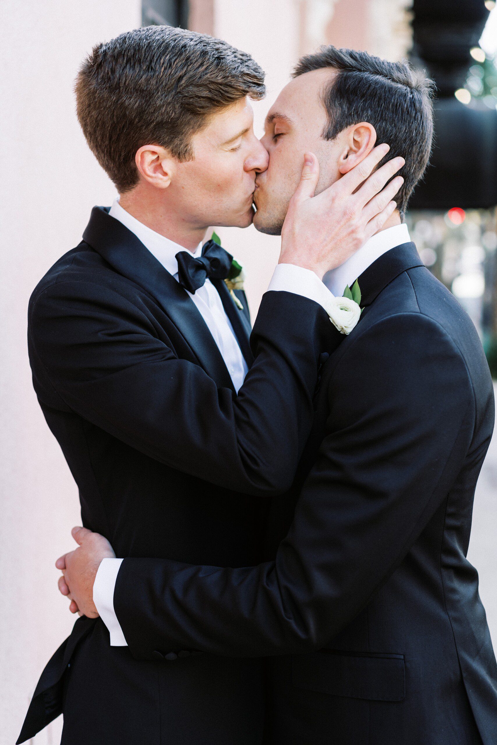 two grooms kissing in Charleston at their wedding