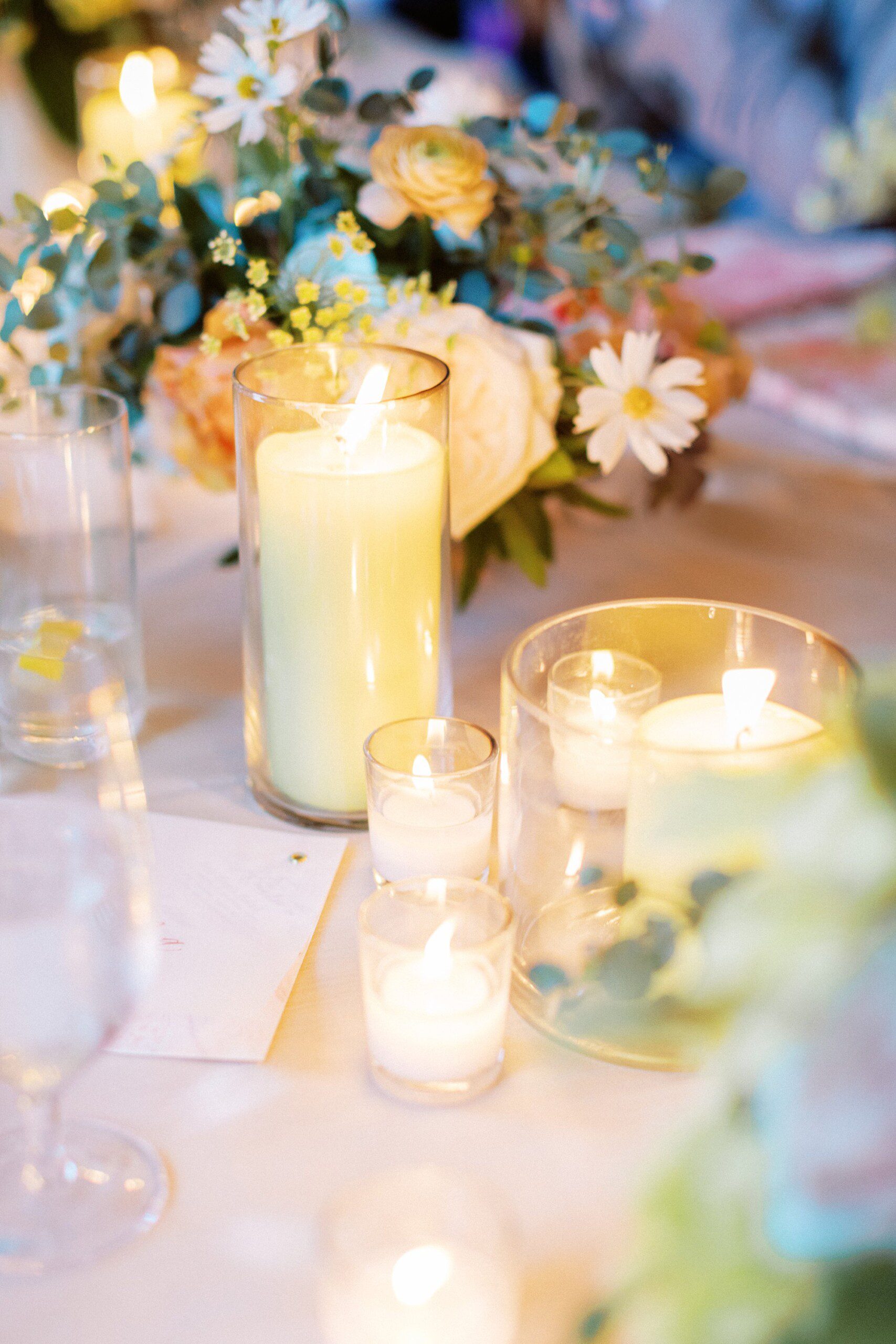 whimsical candle lit wedding reception decor with lime green candles and delicate florals