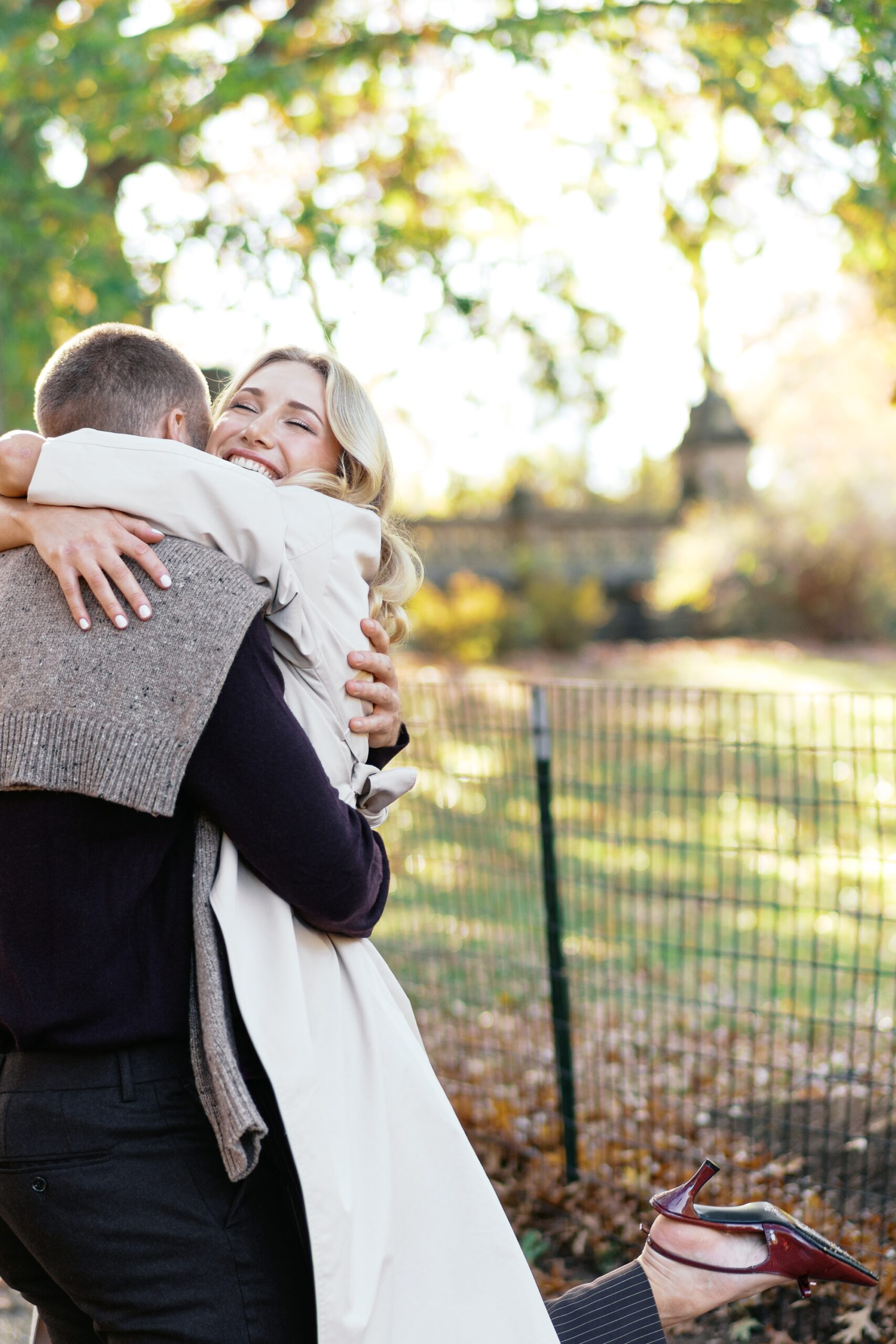 Candid moment of an engaged couple embracing by Tampa engagement photographer Catherine Ann Photography