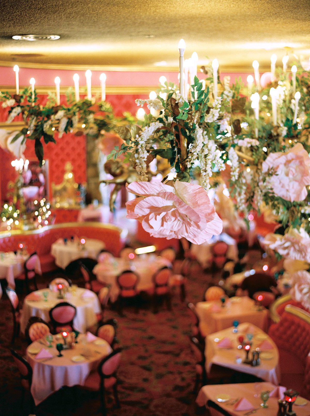 the dining room set for a wedding reception at the Madonna Inn in California