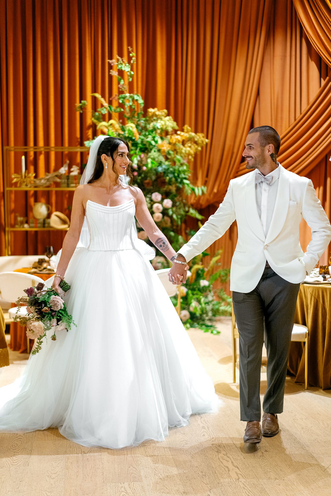 a luxury wedding reception at the Tampa Edition with draping by Parties a la Carte and florals by The Floral Way
