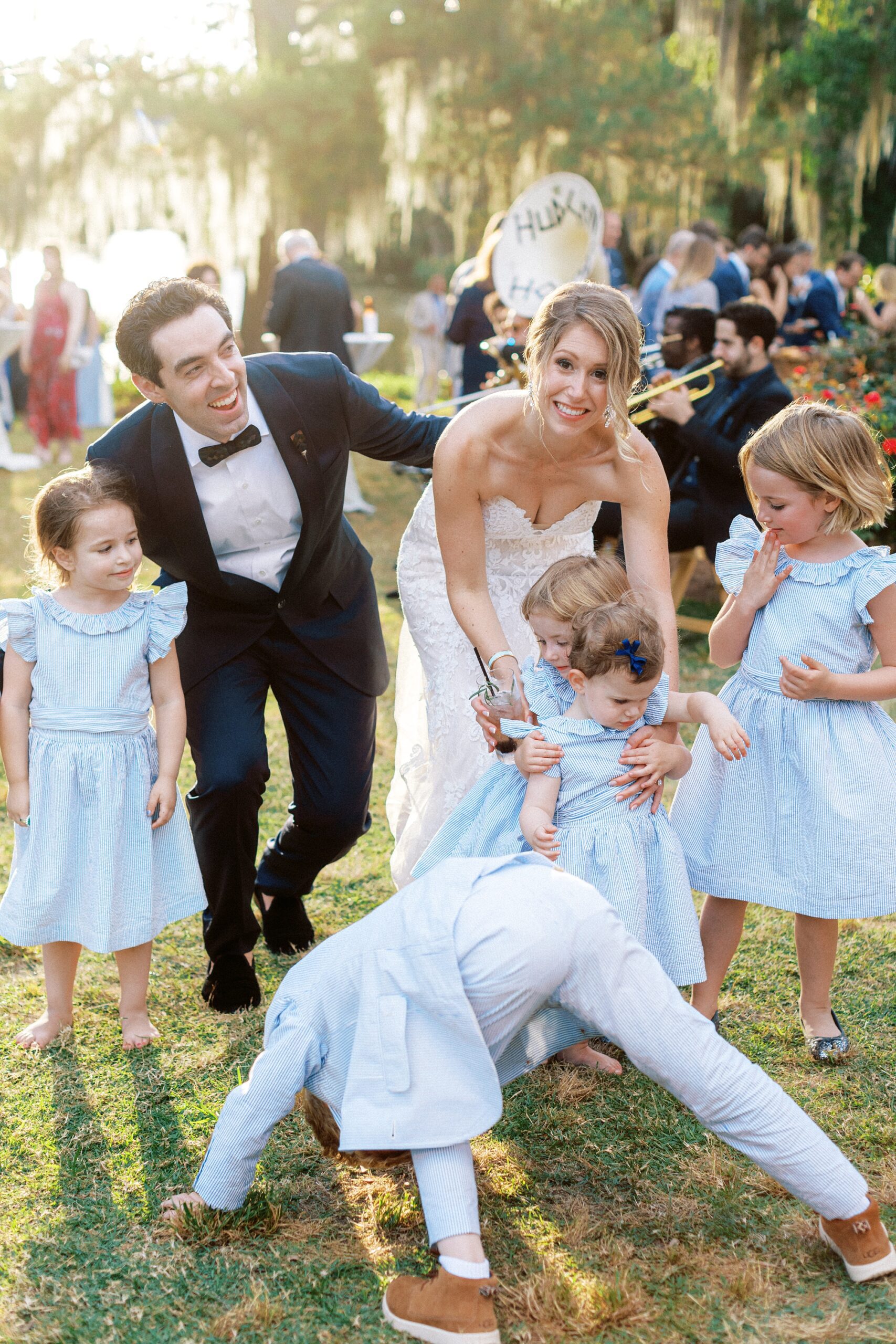 a candid fun wedding photo during a Florida cocktail hour with the kids playing