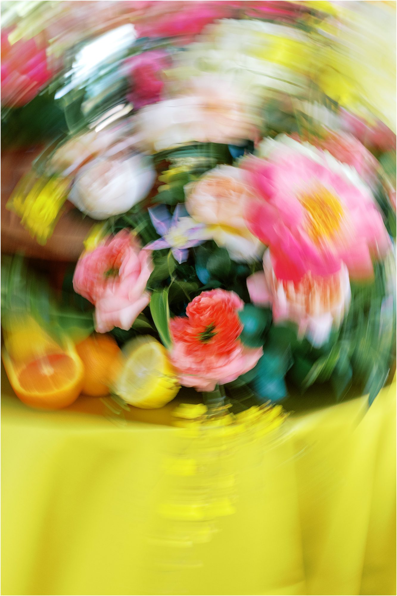 Colorful wedding flowers photographed with creative motion blur at the Colony Hotel